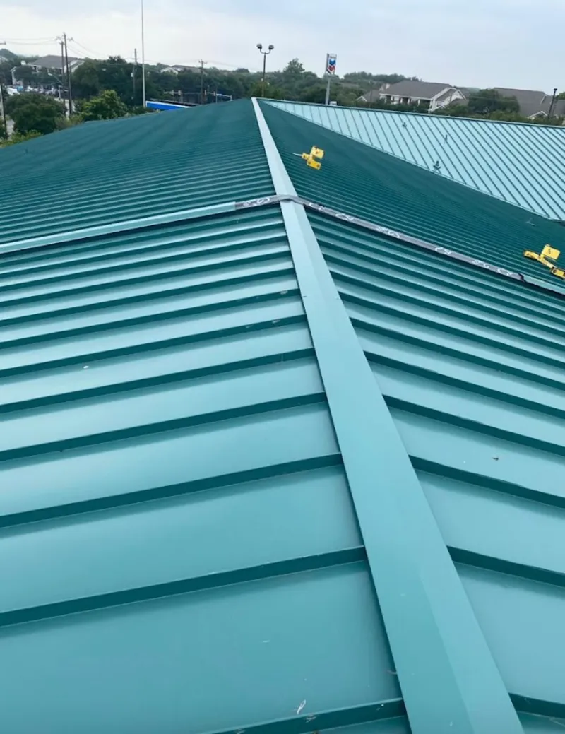Green commercial metal roof ridge and valley for Metal Roof Repair in Enfield